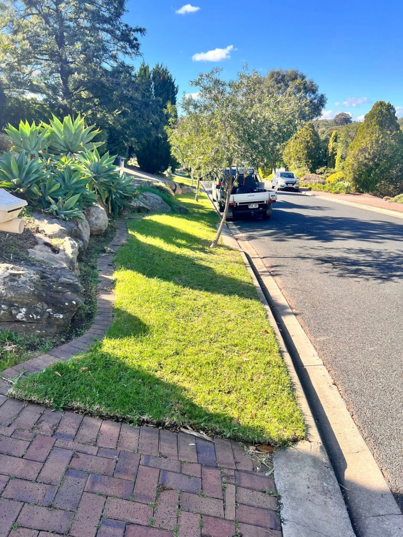 Jordan's work ute parked kerbside after a freshly mowed nature strip in Adelaide's northern suburbs